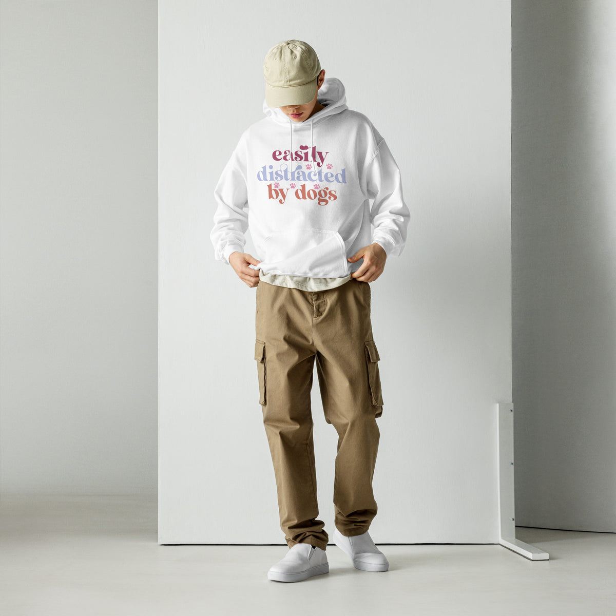 Easily Distracted by Dogs hoodie with colorful lettering and paw prints